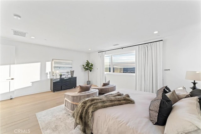 bedroom with visible vents, recessed lighting, and wood finished floors