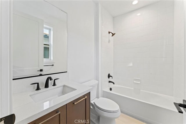 full bathroom with toilet, bathing tub / shower combination, and vanity