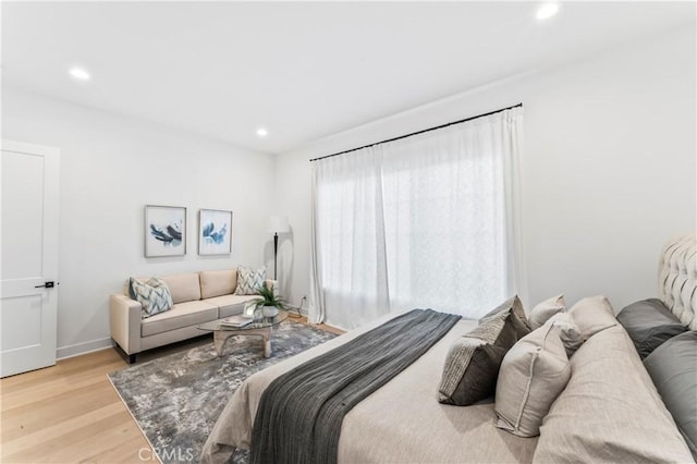 bedroom featuring recessed lighting, light wood-style floors, and baseboards