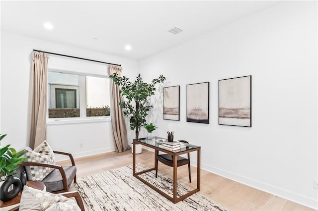 home office with visible vents, baseboards, recessed lighting, and light wood-style floors