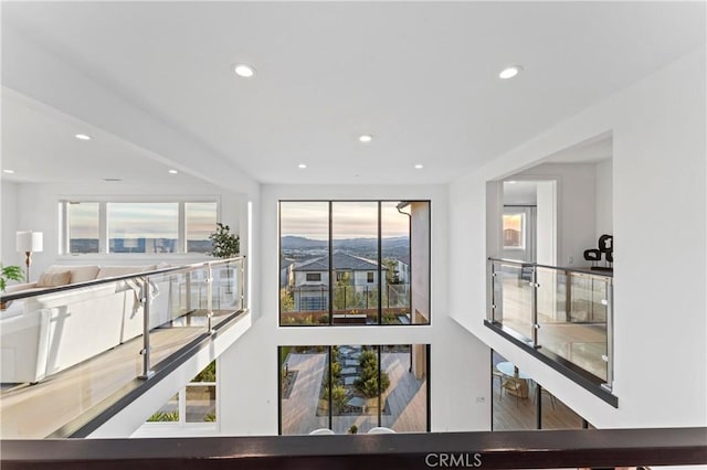 interior space featuring recessed lighting, wood finished floors, and a healthy amount of sunlight