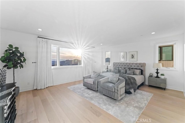 bedroom featuring light wood-style flooring, recessed lighting, and baseboards
