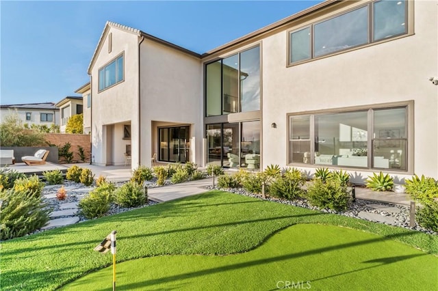 back of property featuring a patio area, fence, and stucco siding