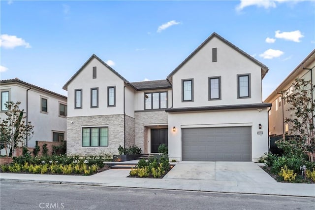 modern farmhouse style home with an attached garage, driveway, and stucco siding