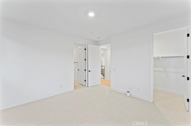 unfurnished bedroom with baseboards and carpet floors