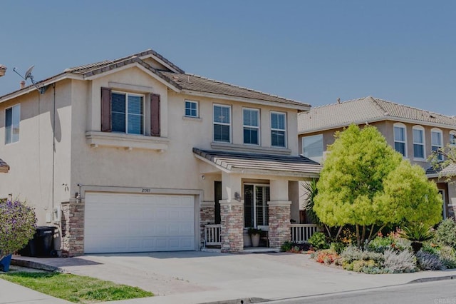craftsman-style house with a tiled roof, a garage, stucco siding, stone siding, and driveway