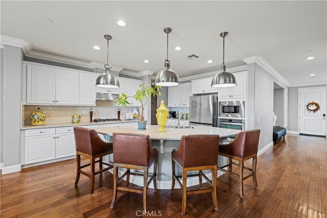 kitchen featuring visible vents, appliances with stainless steel finishes, under cabinet range hood, recessed lighting, and decorative backsplash