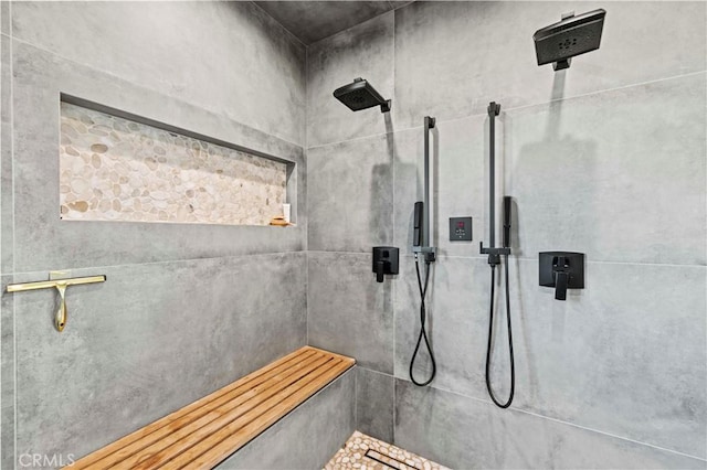 full bath with a tile shower