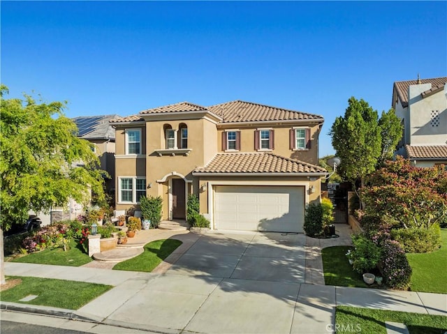 mediterranean / spanish-style house featuring a tiled roof, fence, driveway, and stucco siding