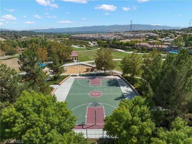 view of basketball court with community basketball court, a mountain view, and a residential view