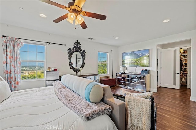 bedroom featuring visible vents, baseboards, a ceiling fan, recessed lighting, and wood finished floors