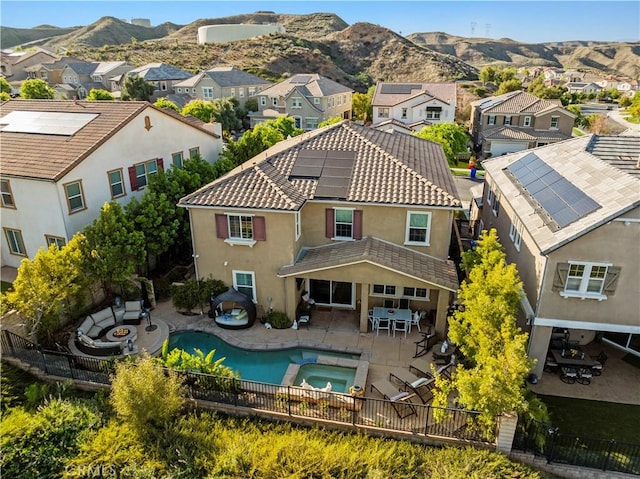 birds eye view of property with a mountain view and a residential view