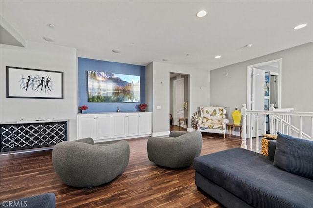 living room with recessed lighting and wood finished floors