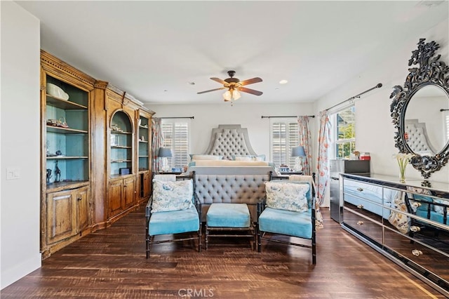 bedroom featuring recessed lighting, multiple windows, baseboards, and wood finished floors