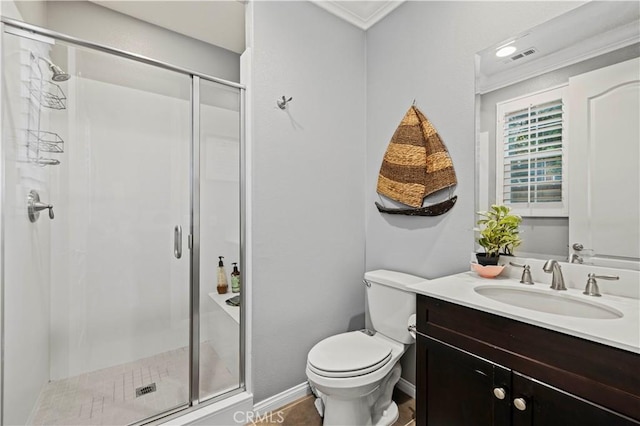 full bathroom with ornamental molding, toilet, a shower stall, and vanity