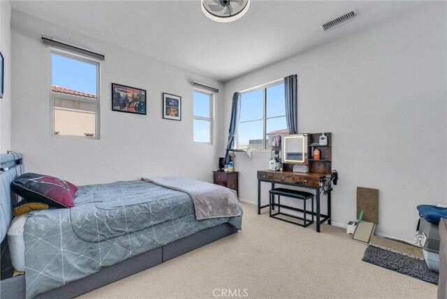 carpeted bedroom featuring baseboards