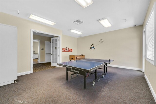 game room featuring french doors, carpet, and baseboards