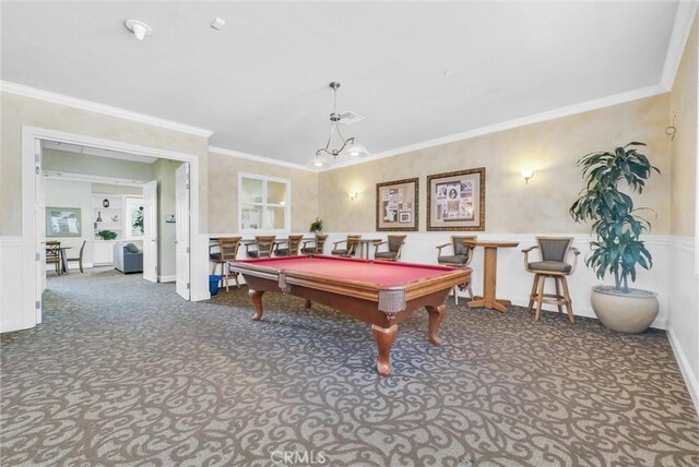 rec room with carpet floors, crown molding, pool table, a wainscoted wall, and a decorative wall