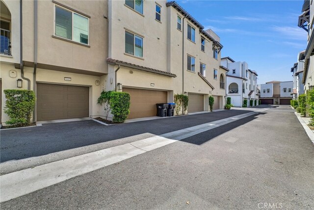 view of asphalt road featuring a residential view