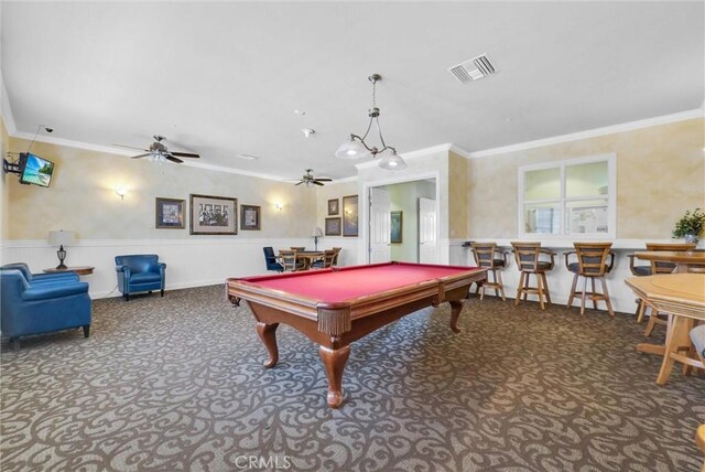 rec room featuring ceiling fan, carpet floors, crown molding, billiards, and a wainscoted wall