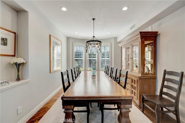6288 Sunnyside Cir, Huntington Beach, CA 92648 - dining area featuring visible vents, baseboards, a chandelier, recessed lighting, and wood finished floors