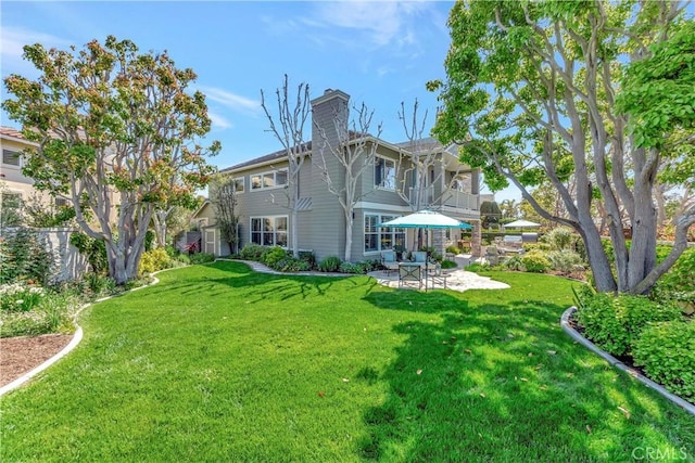 6288 Sunnyside Cir, Huntington Beach, CA 92648 - rear view of property featuring a patio area, a balcony, a chimney, and a lawn