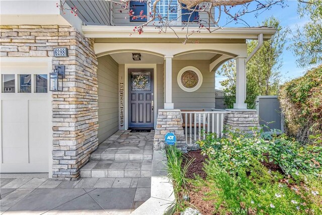 6288 Sunnyside Cir, Huntington Beach, CA 92648 - property entrance with stone siding and covered porch