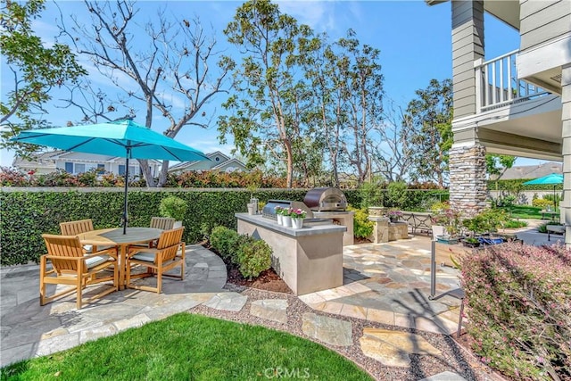 6288 Sunnyside Cir, Huntington Beach, CA 92648 - view of patio featuring grilling area, outdoor dining space, a balcony, and an outdoor kitchen