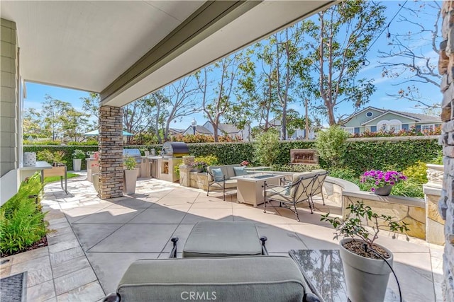 6288 Sunnyside Cir, Huntington Beach, CA 92648 - view of patio featuring a grill, an outdoor living space with a fire pit, and area for grilling