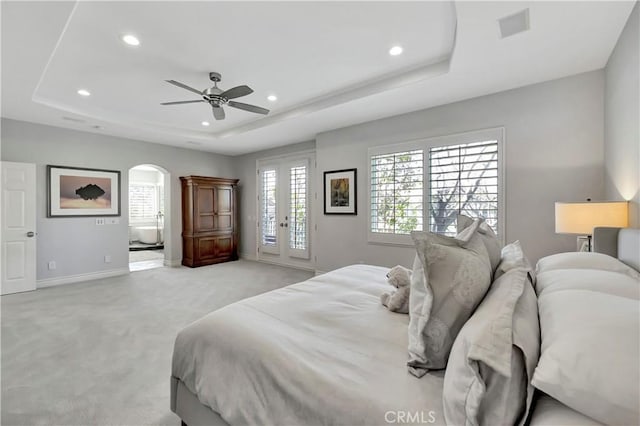 6288 Sunnyside Cir, Huntington Beach, CA 92648 - bedroom with visible vents, a tray ceiling, recessed lighting, and light carpet