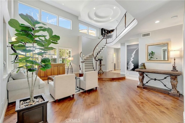 6288 Sunnyside Cir, Huntington Beach, CA 92648 - living room featuring visible vents, baseboards, recessed lighting, stairway, and wood finished floors