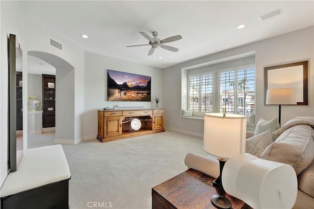 6288 Sunnyside Cir, Huntington Beach, CA 92648 - living area with visible vents, arched walkways, a ceiling fan, recessed lighting, and light carpet