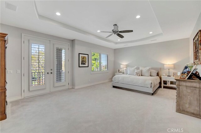 6288 Sunnyside Cir, Huntington Beach, CA 92648 - bedroom with a tray ceiling, access to exterior, light colored carpet, and recessed lighting