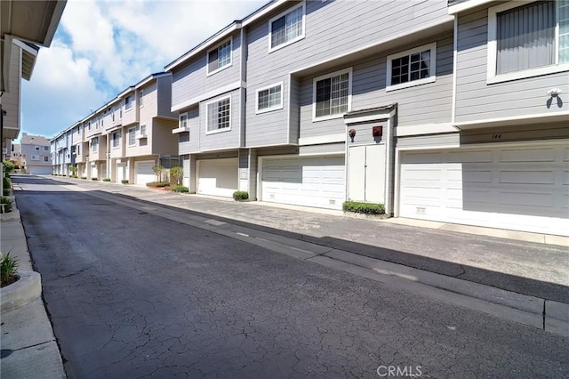 view of street with a residential view and sidewalks