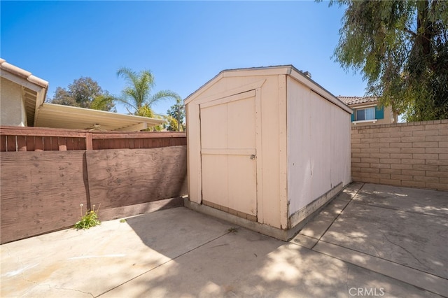view of shed featuring a fenced backyard