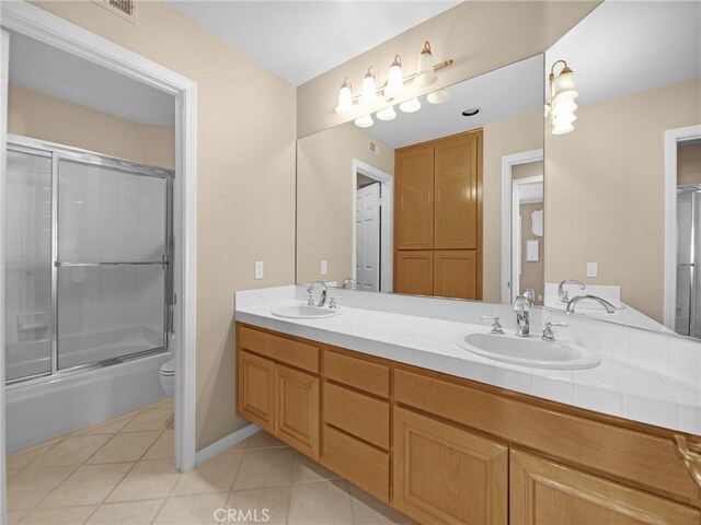 125 Heath Meadow Pl, Simi Valley, CA 93065 - full bathroom with double vanity, tile patterned flooring, and shower / bath combination with glass door