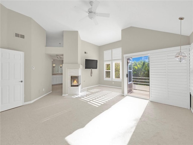 125 Heath Meadow Pl, Simi Valley, CA 93065 - unfurnished living room featuring carpet flooring, high vaulted ceiling, a glass covered fireplace, and ceiling fan
