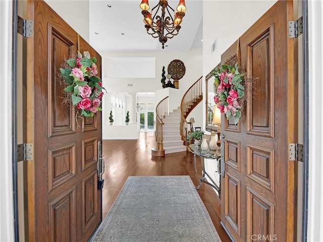 125 Heath Meadow Pl, Simi Valley, CA 93065 - foyer with stairs, a chandelier, dark wood finished floors, and a high ceiling