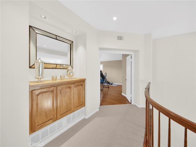 125 Heath Meadow Pl, Simi Valley, CA 93065 - hall featuring light colored carpet, recessed lighting, and an upstairs landing