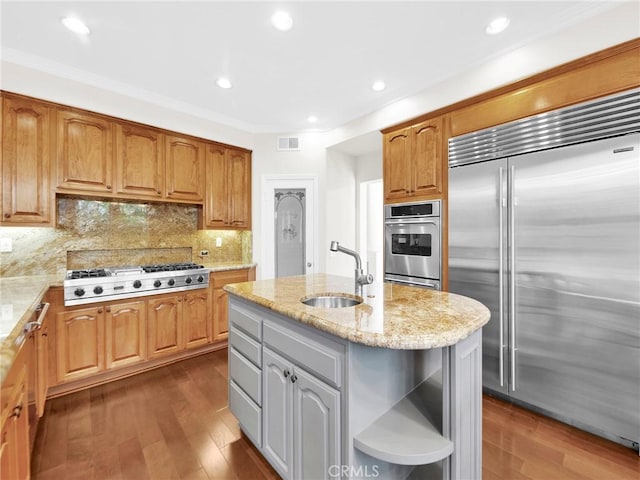 125 Heath Meadow Pl, Simi Valley, CA 93065 - kitchen featuring appliances with stainless steel finishes, open shelves, dark wood finished floors, light stone countertops, and recessed lighting