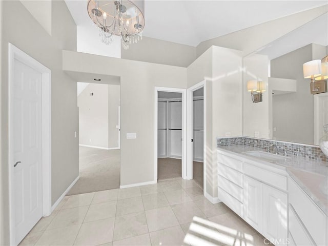 125 Heath Meadow Pl, Simi Valley, CA 93065 - bathroom with a chandelier, vanity, a closet, and tile patterned floors