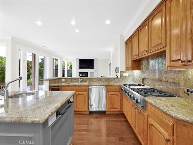 125 Heath Meadow Pl, Simi Valley, CA 93065 - kitchen featuring appliances with stainless steel finishes, healthy amount of natural light, light stone countertops, recessed lighting, and ornamental molding