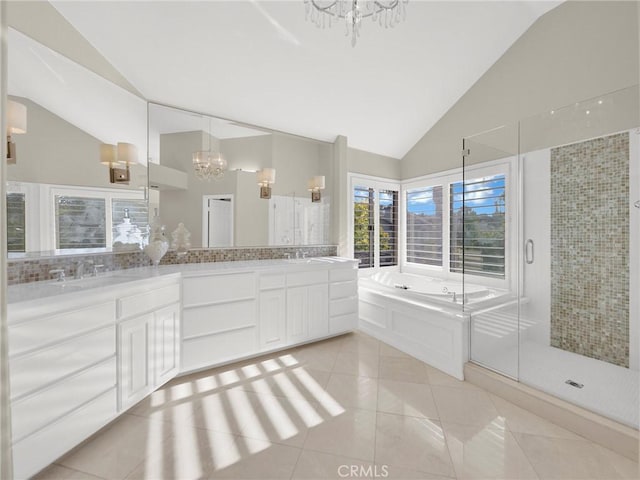 125 Heath Meadow Pl, Simi Valley, CA 93065 - full bathroom with a chandelier, a bath, double vanity, tile patterned floors, and a shower stall
