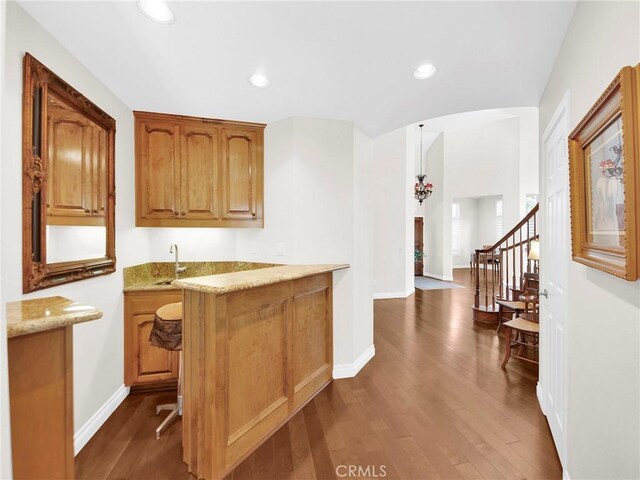 125 Heath Meadow Pl, Simi Valley, CA 93065 - indoor wet bar with dark wood-style flooring, recessed lighting, stairs, and arched walkways