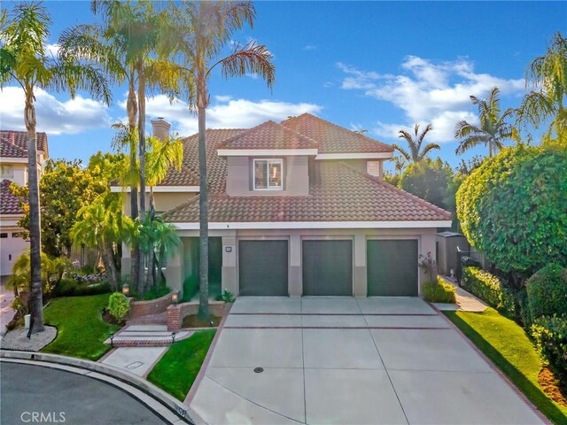 125 Heath Meadow Pl, Simi Valley, CA 93065 - mediterranean / spanish-style home with concrete driveway, a tiled roof, stucco siding, and a chimney