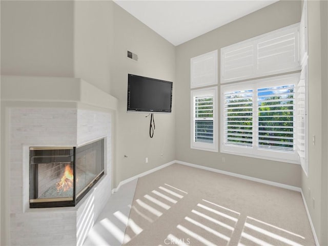 125 Heath Meadow Pl, Simi Valley, CA 93065 - unfurnished living room with carpet floors, a multi sided fireplace, and vaulted ceiling