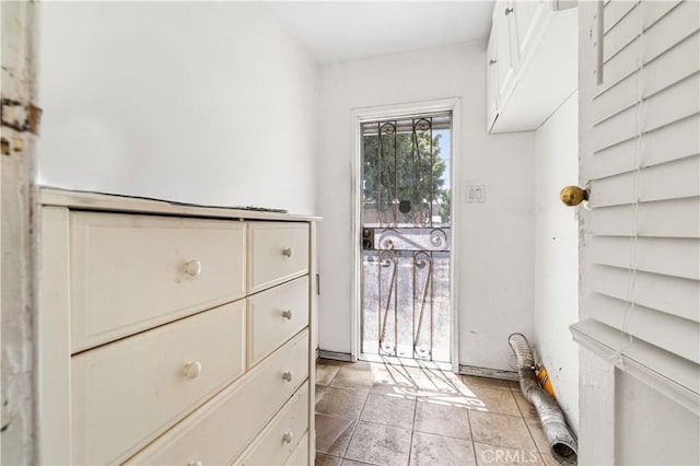 spacious closet featuring light tile patterned flooring