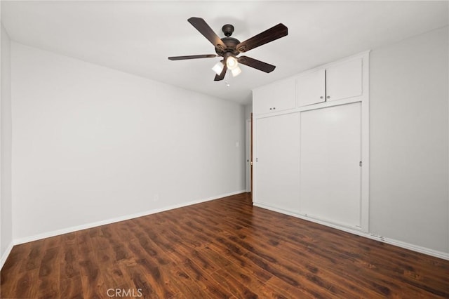 1026 De Garmo Dr, Los Angeles, CA 90063 - unfurnished bedroom featuring a closet, baseboards, ceiling fan, and dark wood-style floors