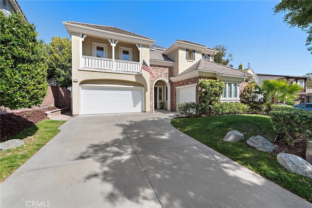 18 Beacon, Ladera Ranch, CA 92694 - view of front facade featuring stone siding, a balcony, stucco siding, a garage, and driveway