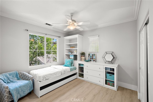 18 Beacon, Ladera Ranch, CA 92694 - bedroom with light wood finished floors, ornamental molding, a closet, and ceiling fan